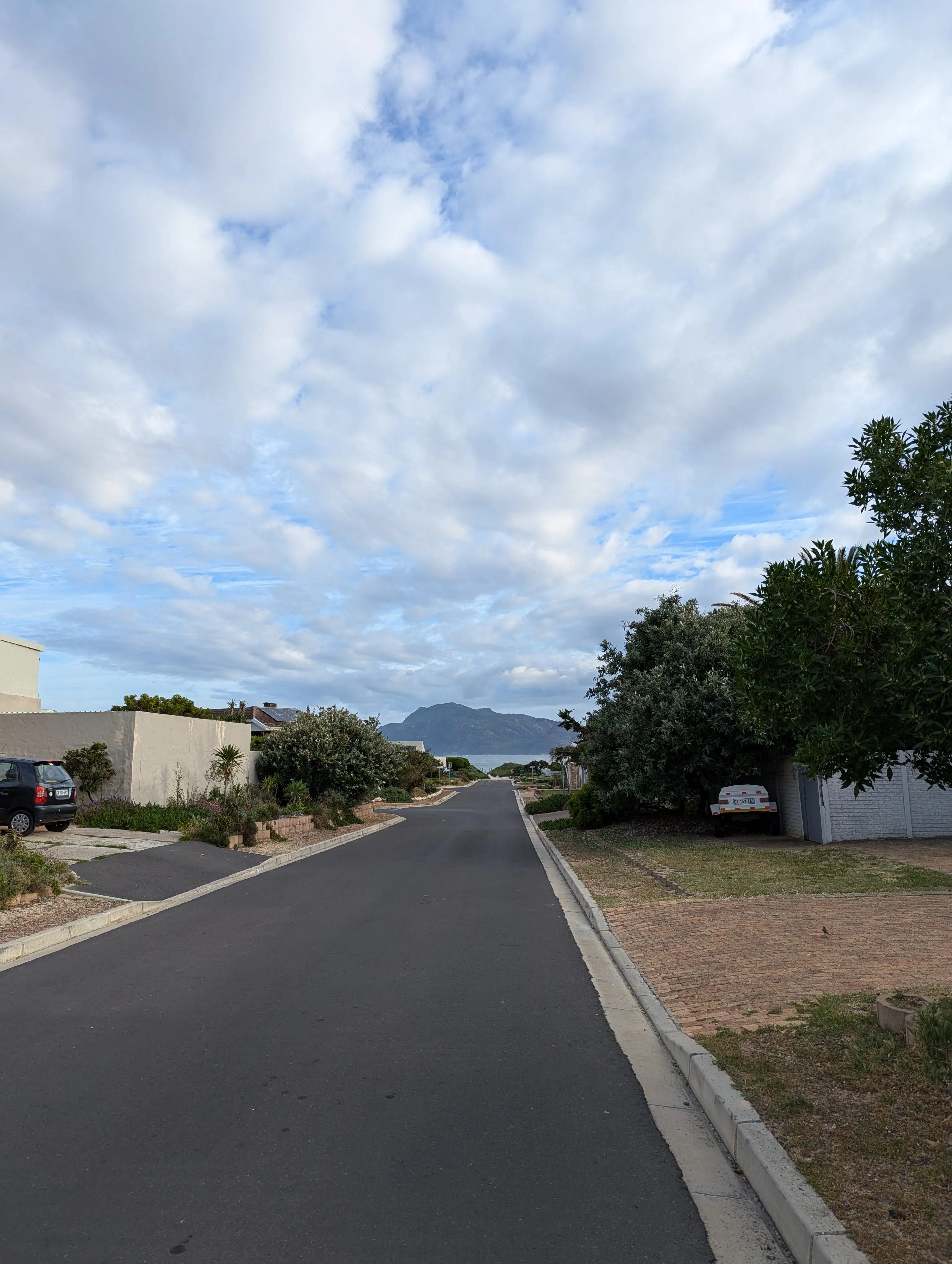 A short 2‑minute walk down the road, then a fynbos path to the beach—10–15 minutes for a swim and you’re back at your desk.